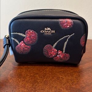 Coach wristlet pouch  black cherry print/ red/sparkles  gold tone hardware NWT